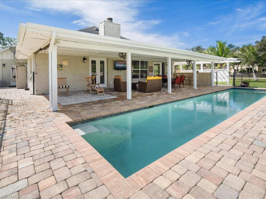 520 Soll Street Naples, FL 34109 - Photo 13 of 31 a view of a house with a backyard