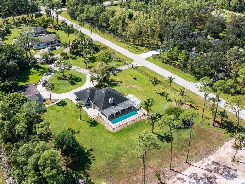 520 Soll Street Naples, FL 34109 - Photo 14 of 31 an aerial view of a house with a yard