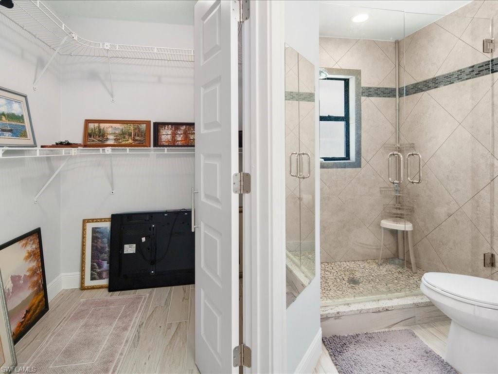 520 Soll Street Naples, FL 34109 - Photo 20 of 31 a bathroom with a sink a toilet and shower