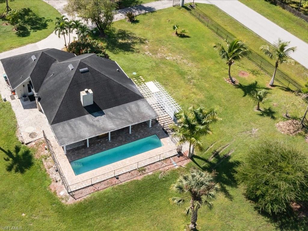 520 Soll Street Naples, FL 34109 - Photo 2 of 31 a view of a house with a backyard