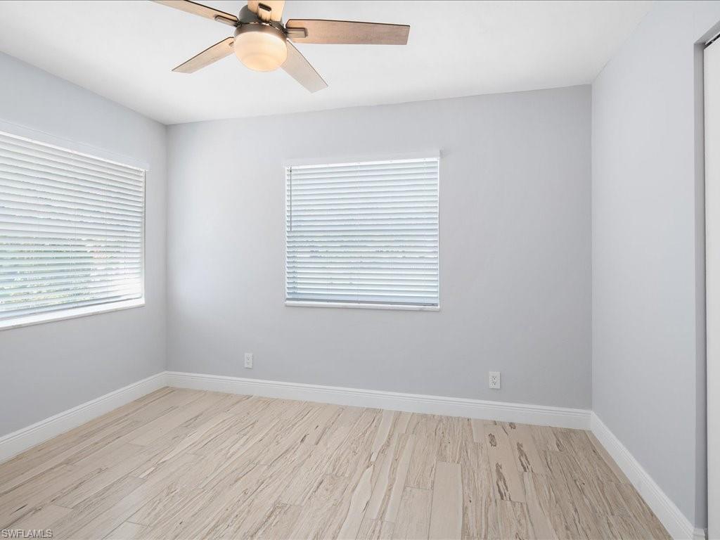 520 Soll Street Naples, FL 34109 - Photo 23 of 31 an empty room with a window and a ceiling fan