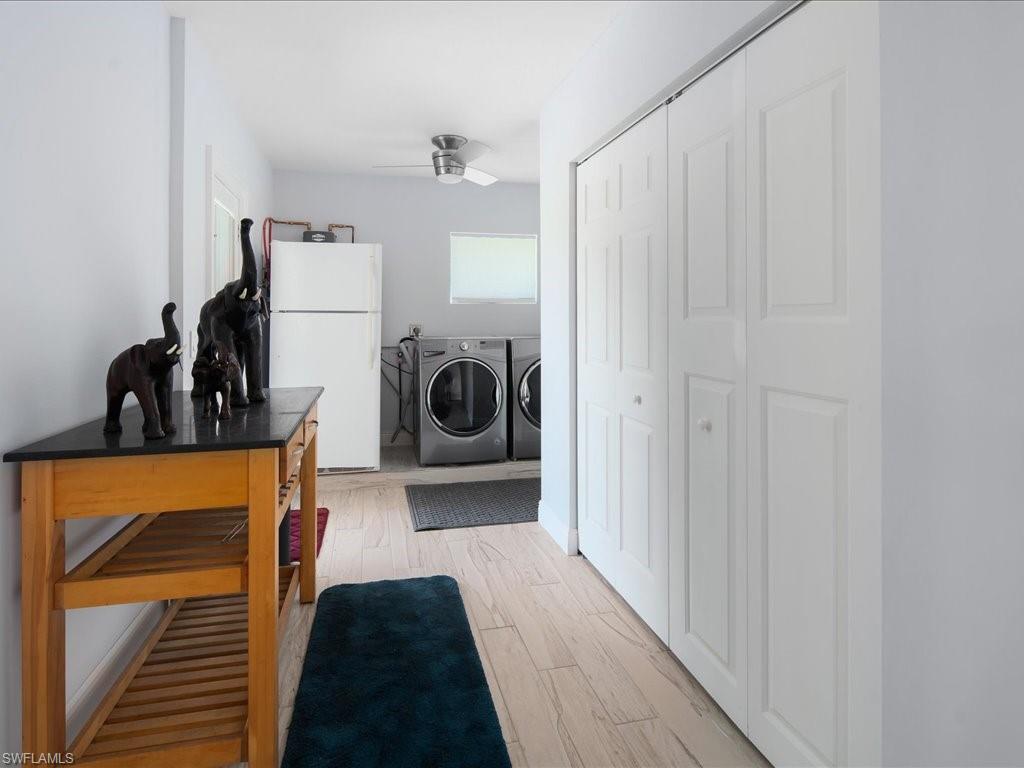 520 Soll Street Naples, FL 34109 - Photo 24 of 31 a view of a hallway with a washer and dryer