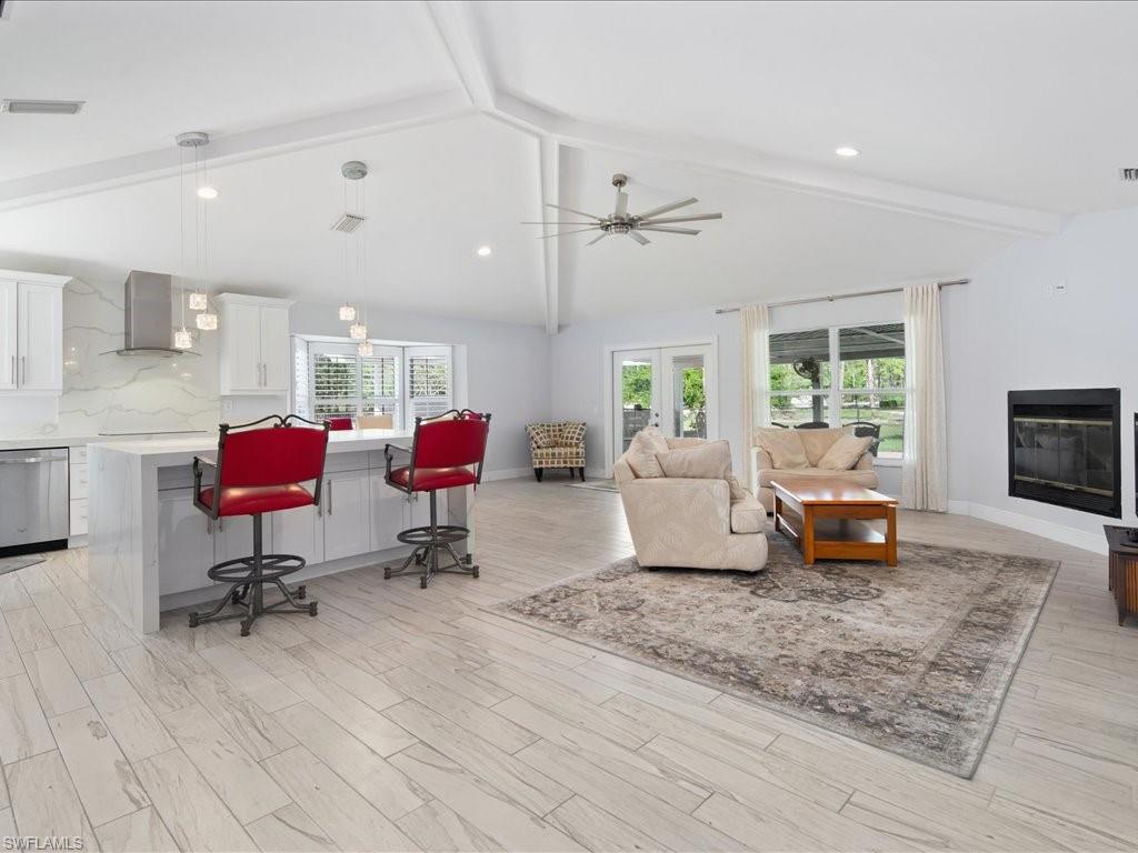 520 Soll Street Naples, FL 34109 - Photo 3 of 31 a living room with furniture and wooden floor