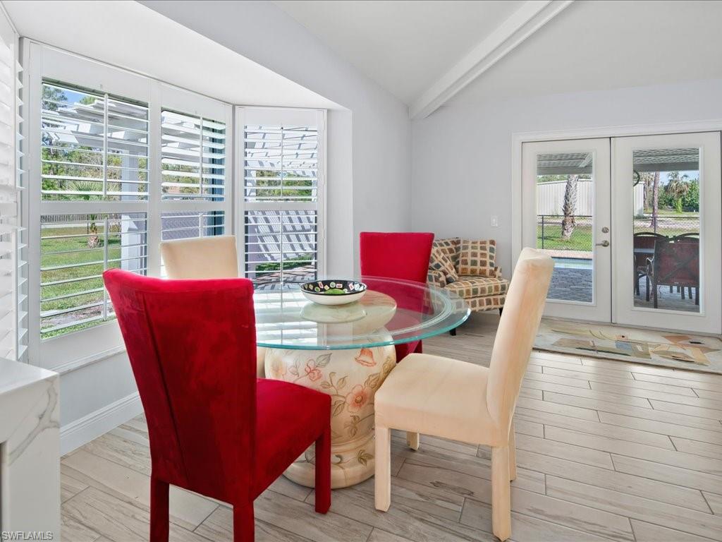 520 Soll Street Naples, FL 34109 - Photo 9 of 31 a view of a dining room with furniture window and wooden floor