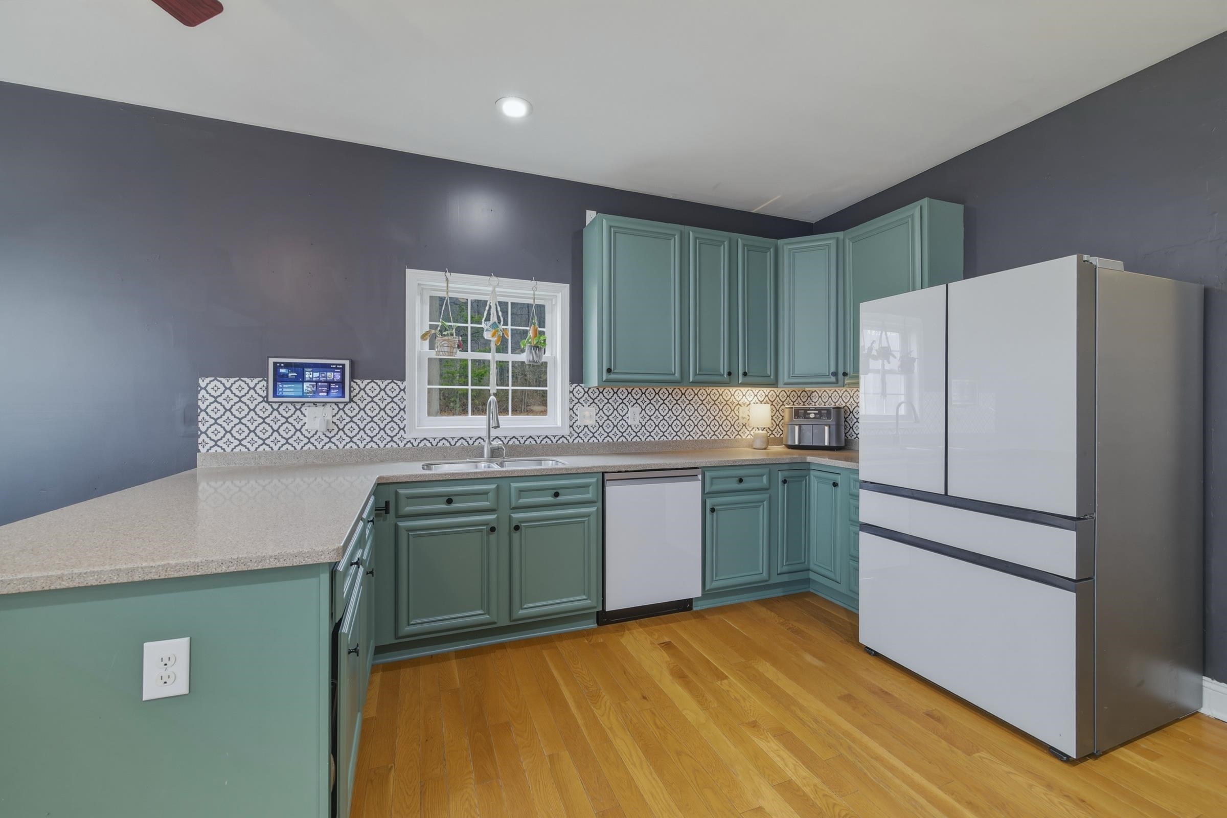257 Hunter Road Maurertown, VA 22644 - Photo 11 of 61 a kitchen with granite countertop a refrigerator and a sink