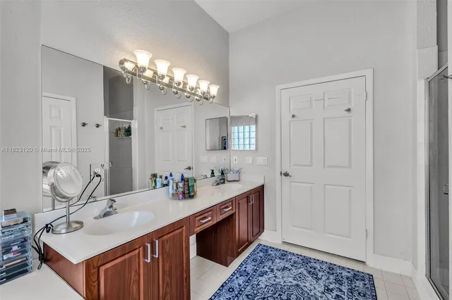 a bathroom with a double vanity sink and a mirror