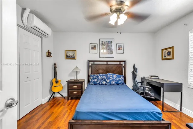 a bedroom with furniture and a fireplace