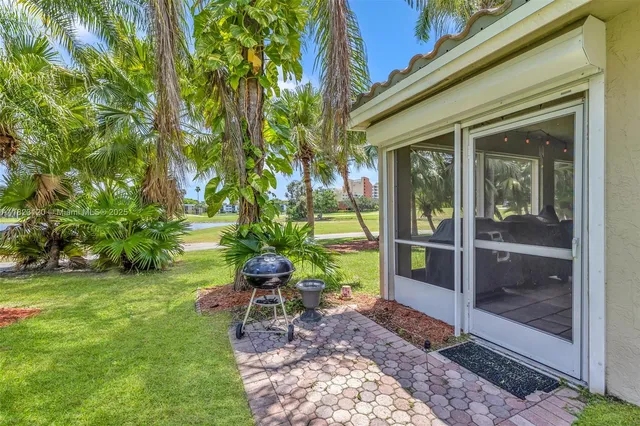 a view of a chair in a backyard of the house