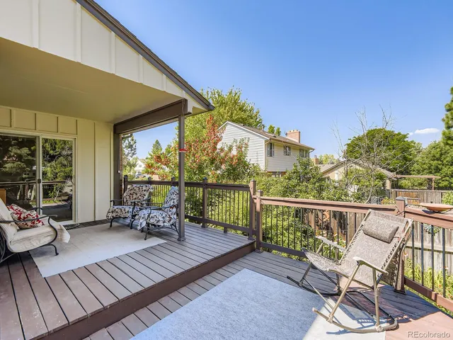 a view of a balcony with wooden fence