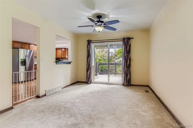 a view of an empty room and a window
