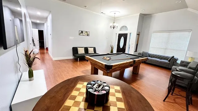 a view of a livingroom with furniture and a kitchen