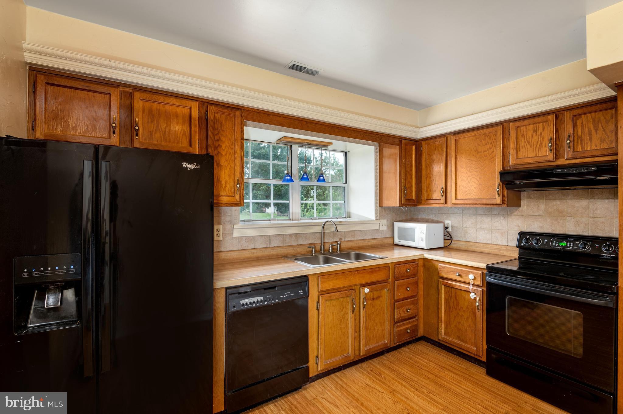 1126 Pond Road Harrisburg, PA 17111 - Photo 8 of 25 Black appliances mark the kitchen well...