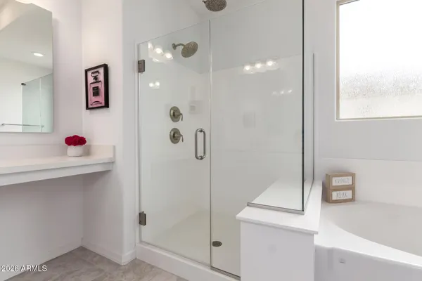 a bathroom with a shower and a sink