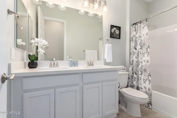 a bathroom with a bathtub and shower