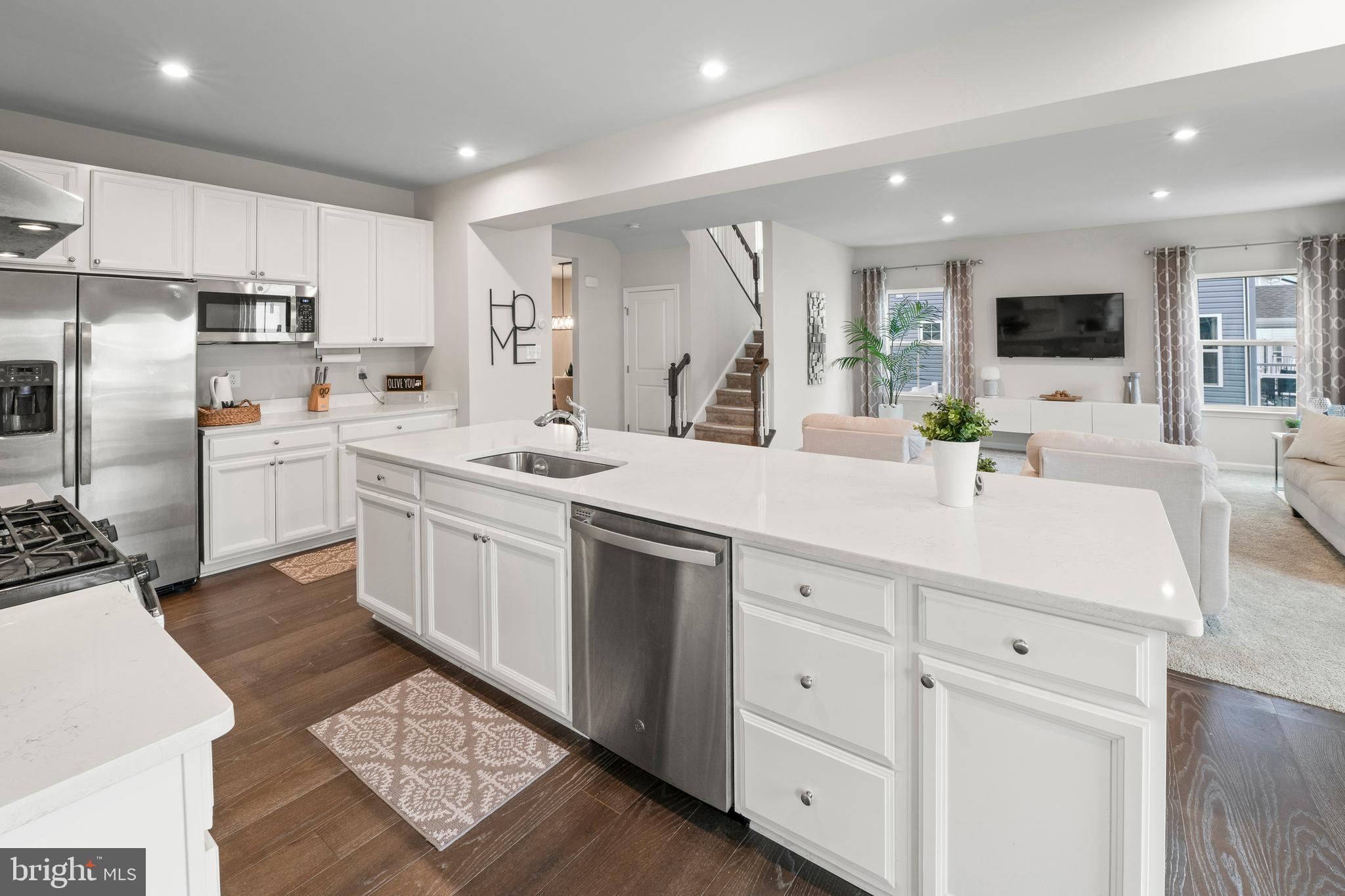 201 Weston Drive Swedesboro, NJ 08085 - Photo 11 of 31 a kitchen with white cabinets and appliances