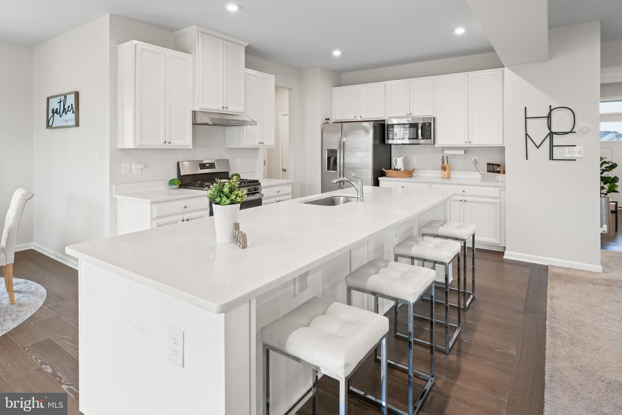 201 Weston Drive Swedesboro, NJ 08085 - Photo 12 of 31 a kitchen with refrigerator and white cabinets