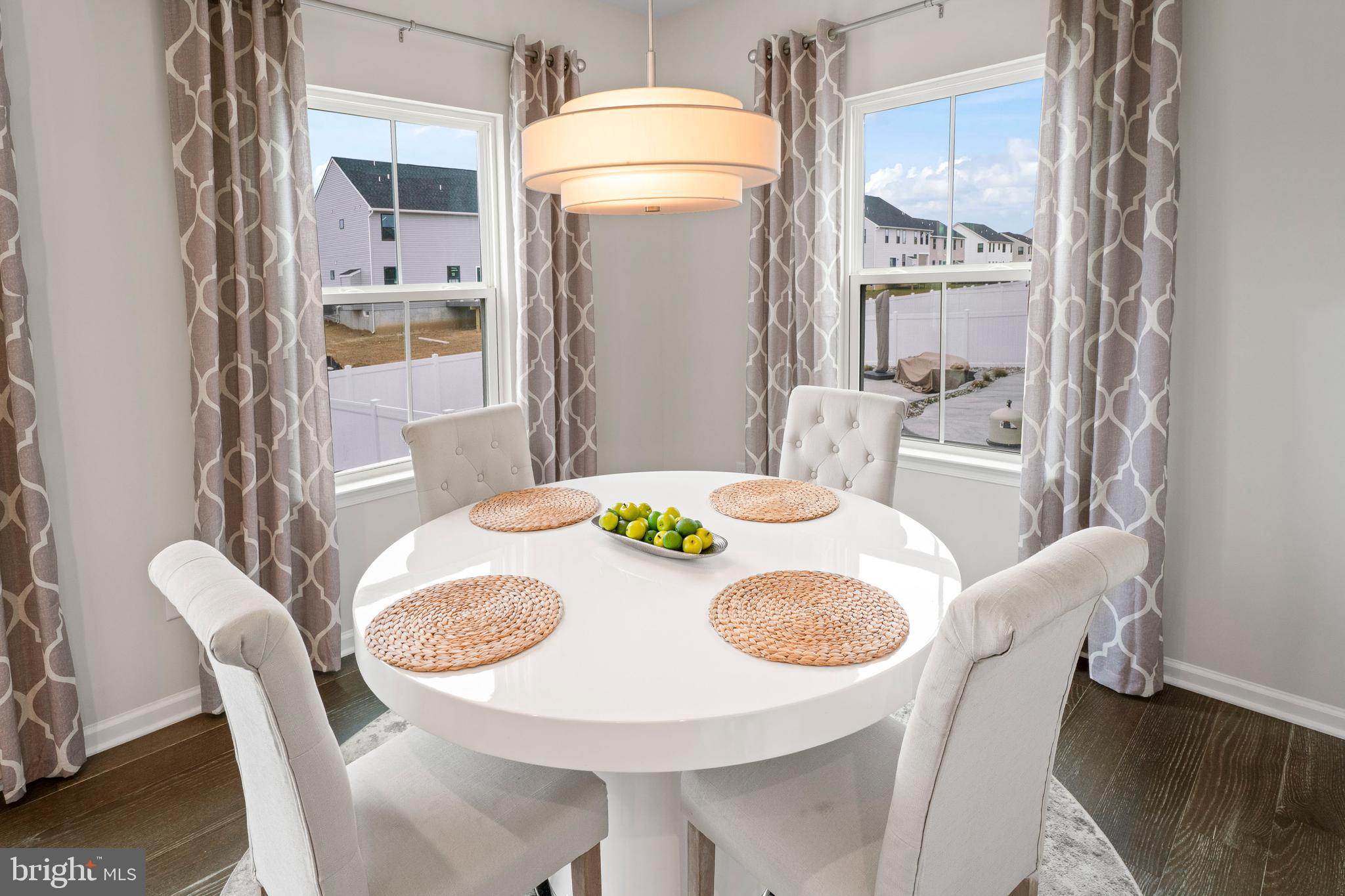 201 Weston Drive Swedesboro, NJ 08085 - Photo 13 of 31 a dining room with furniture and a chandelier
