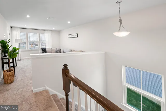 a view of a kitchen and an entryway