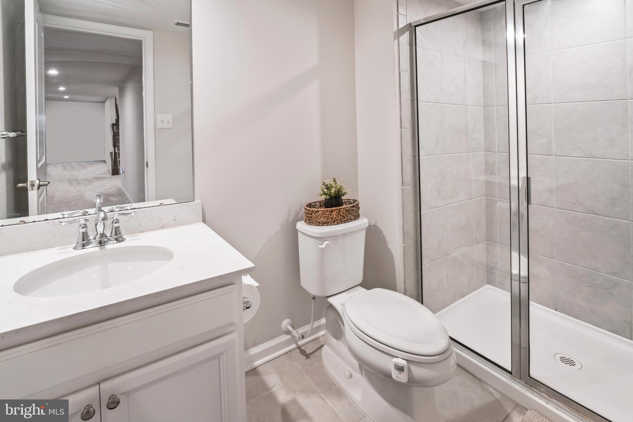 201 Weston Drive Swedesboro, NJ 08085 - Photo 17 of 31 a white toilet sitting next to a bathroom sink