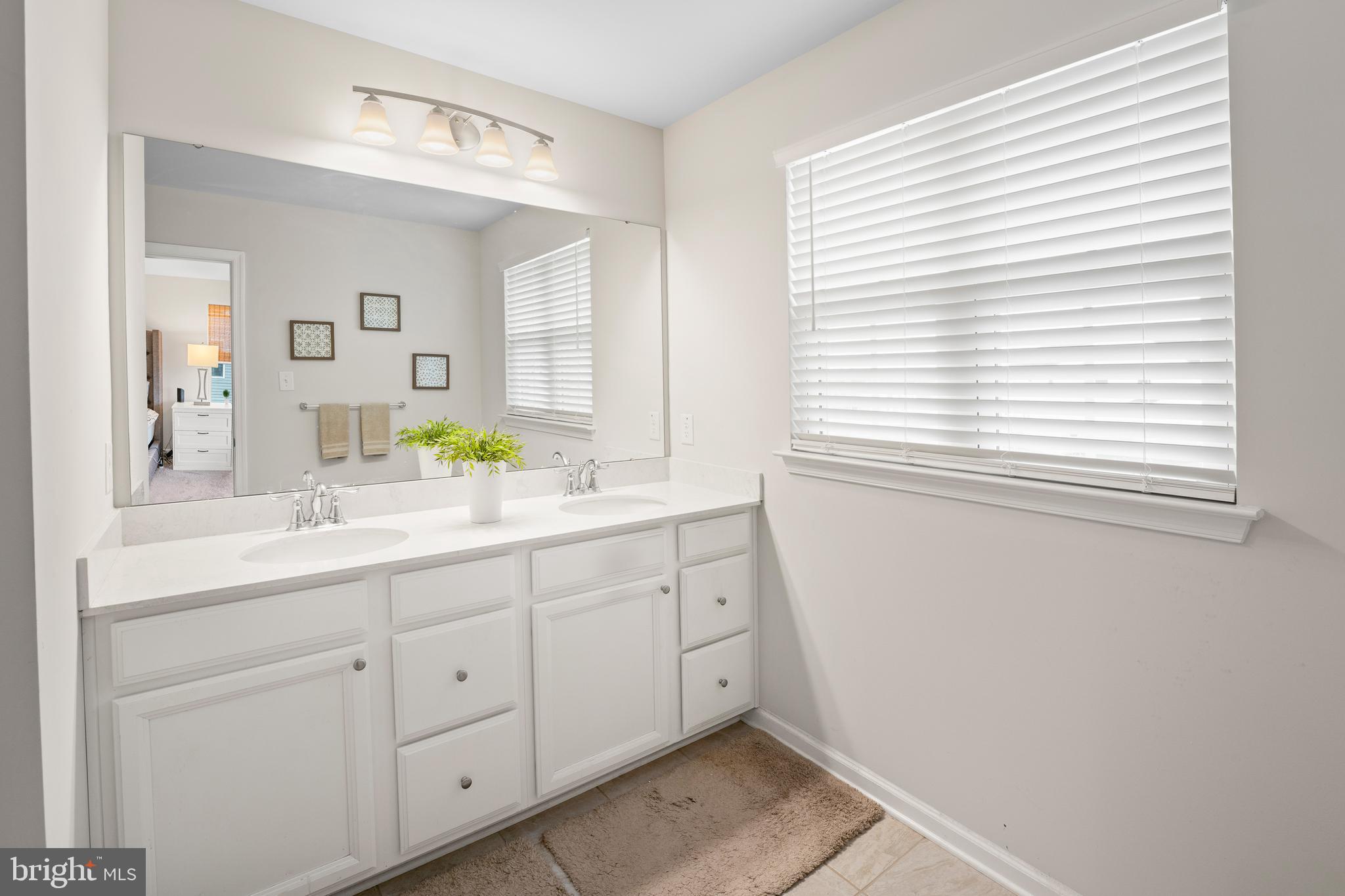 201 Weston Drive Swedesboro, NJ 08085 - Photo 18 of 31 a bathroom with a sink and two mirror
