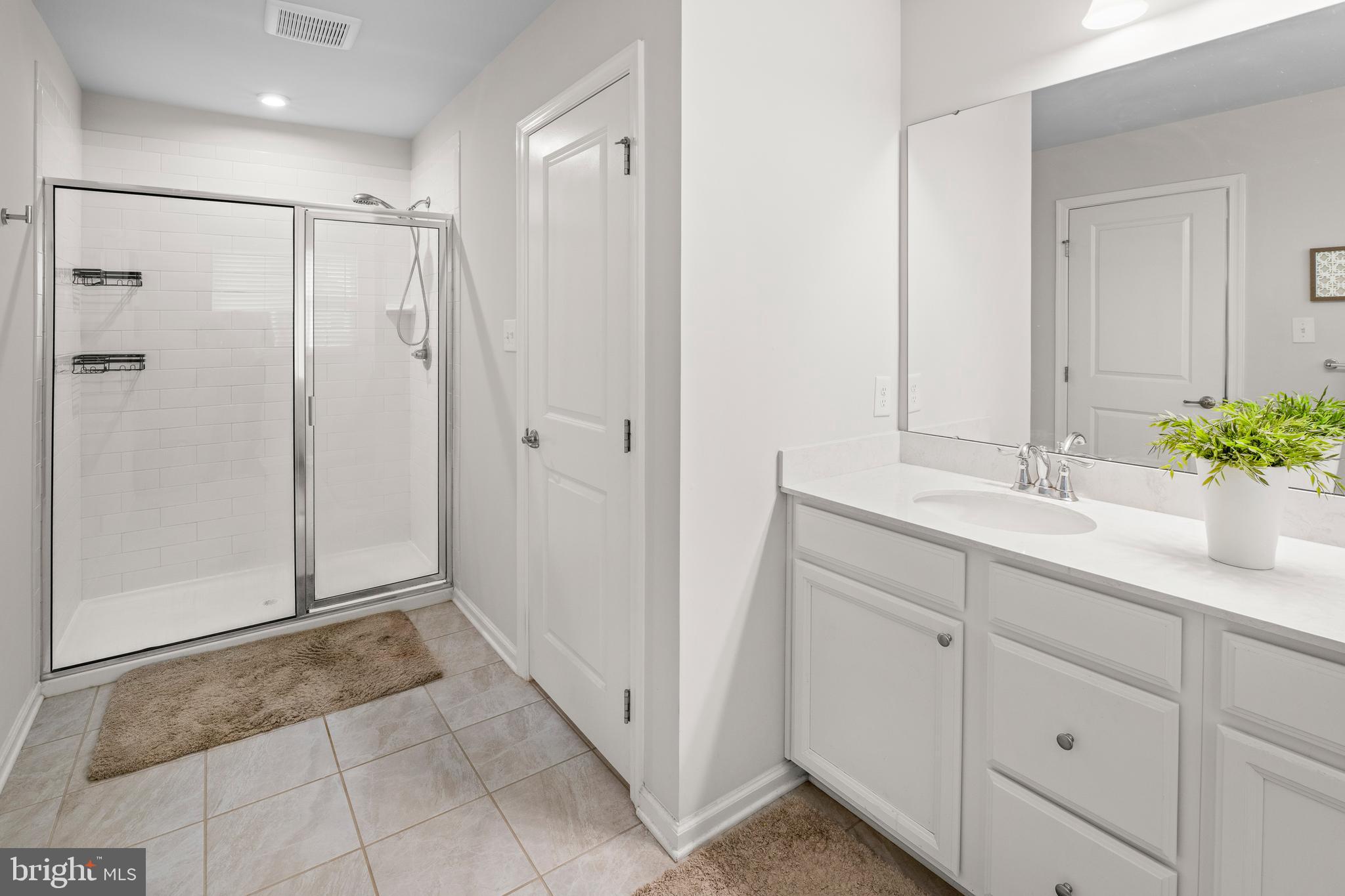 201 Weston Drive Swedesboro, NJ 08085 - Photo 19 of 31 a bathroom with a shower sink and mirror