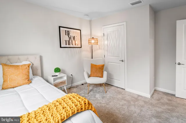 a bedroom with bed and window