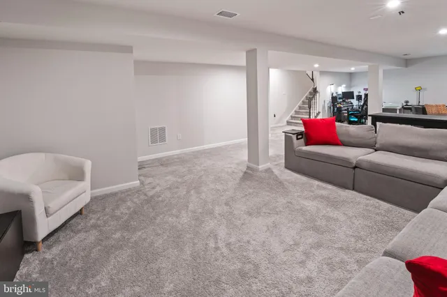 a living room with furniture and a couch