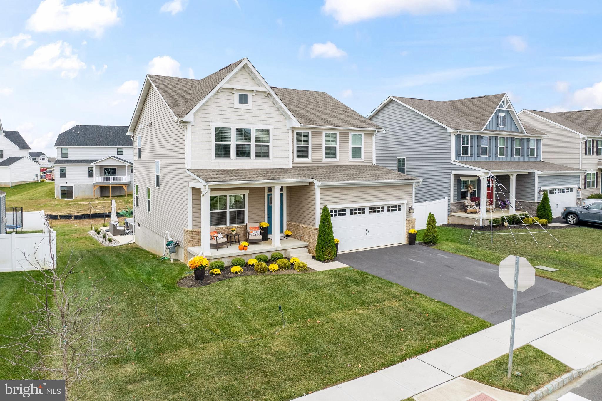 201 Weston Drive Swedesboro, NJ 08085 - Photo 30 of 31 a front view of a residential houses with yard and green space