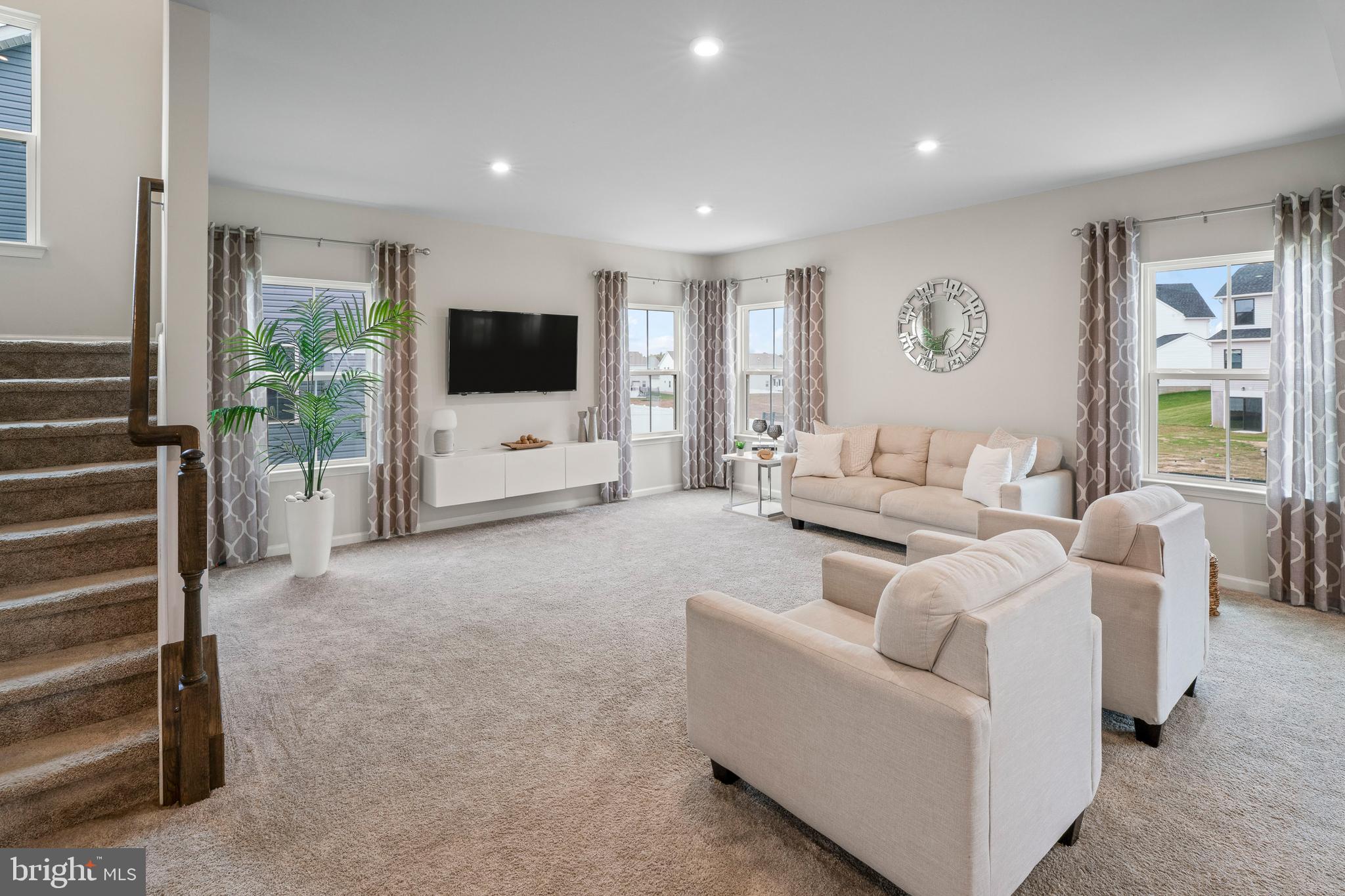 201 Weston Drive Swedesboro, NJ 08085 - Photo 3 of 31 a living room with furniture and a flat screen tv