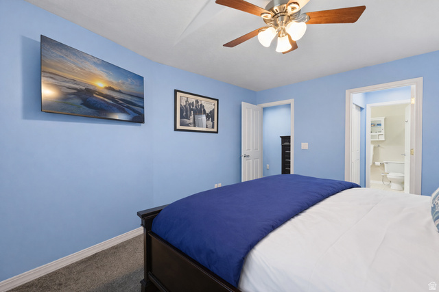 1625 Pages Pl Drive Bountiful, UT 84010 - Photo 14 of 31 Primary bedroom with dark colored carpet, ensuite bath, a ceiling fan, and a spacious closet
