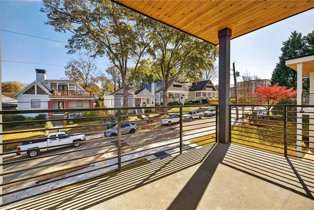 a view of a balcony with wooden floor