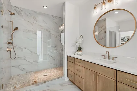 a bathroom with a sink a vanity and a mirror