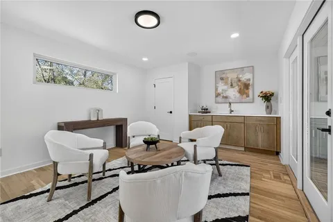 a view of a dining room with furniture and wooden floor