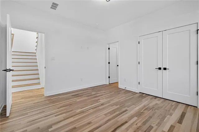 a view of room with hardwood floor
