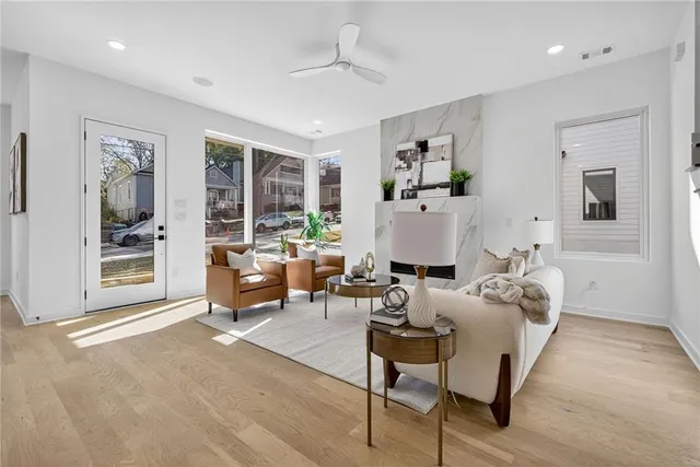 a living room with furniture and a fireplace