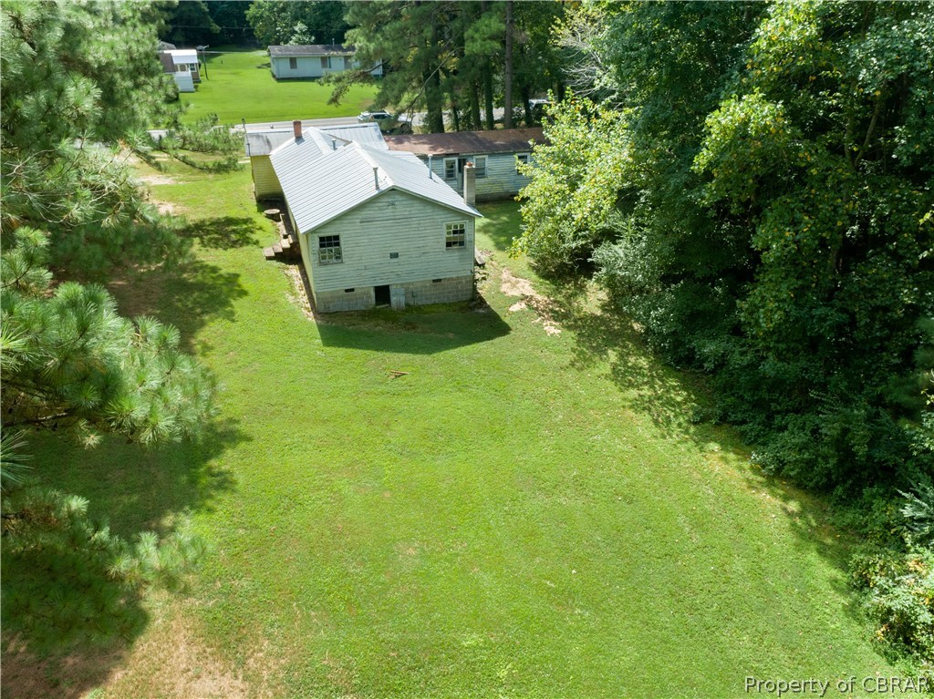1220 Weems Road Weems, VA 22576 - Photo 5 of 12 an aerial view of a house with a yard