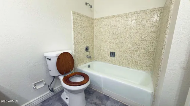 a bathroom with a sink a toilet and bathtub