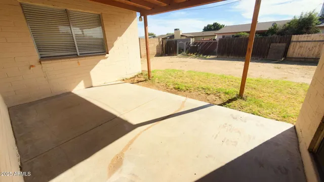 a view of a swimming pool with a chair
