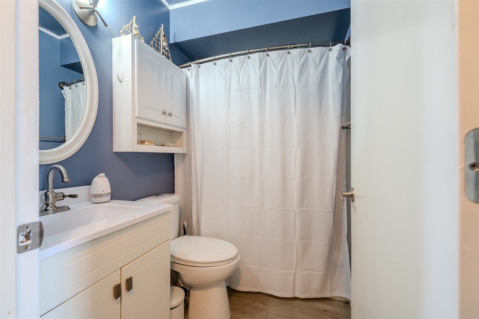 1704 Braden Drive Normal, IL 61761 - Photo 15 of 31 a bathroom with a sink a toilet and shower curtain