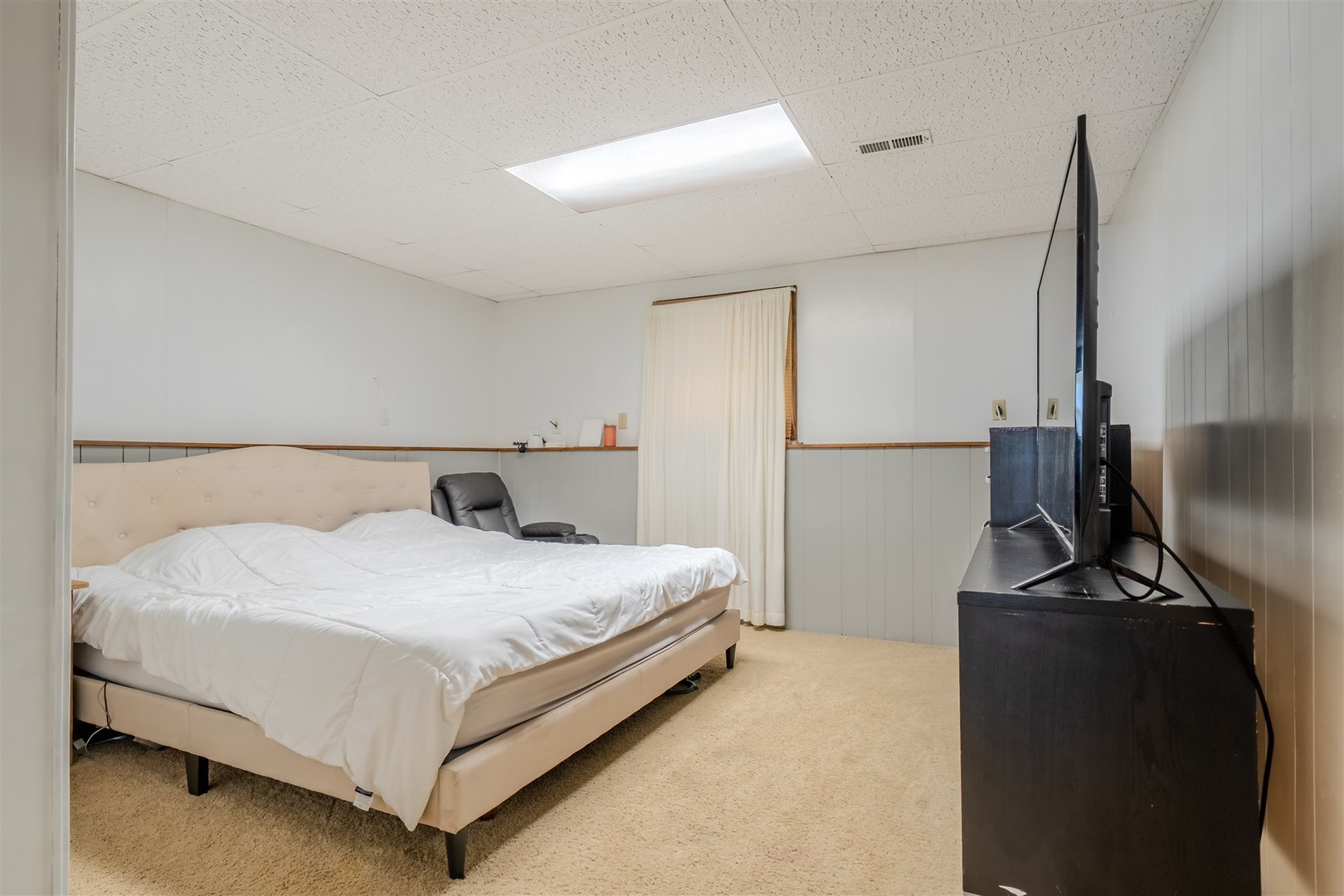 1704 Braden Drive Normal, IL 61761 - Photo 17 of 31 a bedroom with a bed and a flat screen tv