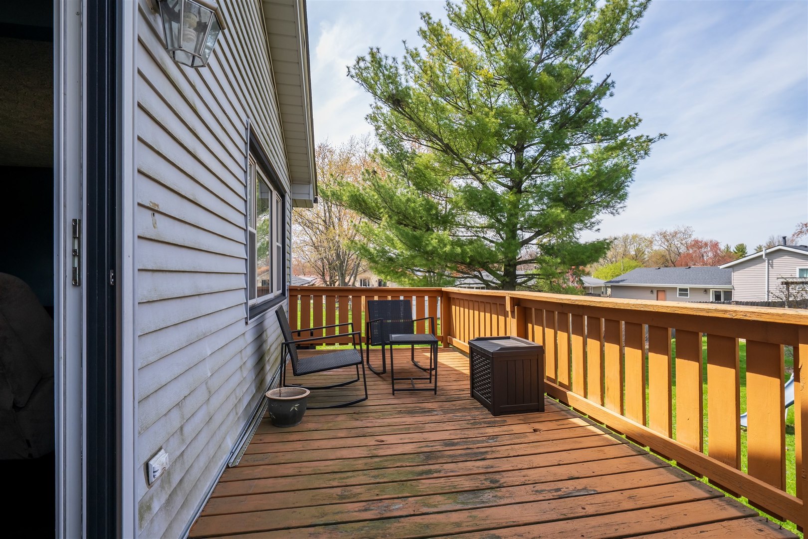 1704 Braden Drive Normal, IL 61761 - Photo 24 of 31 a balcony with wooden floor and fence