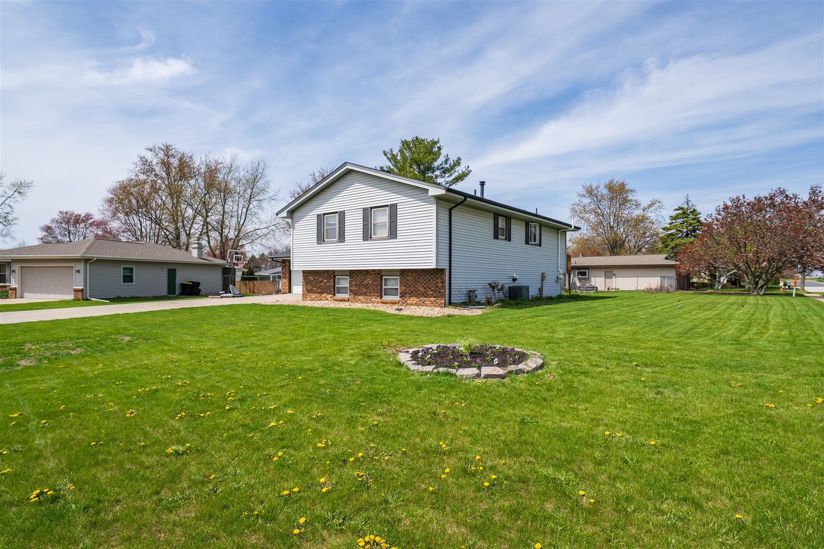 1704 Braden Drive Normal, IL 61761 - Photo 27 of 31 a front view of a house with a yard