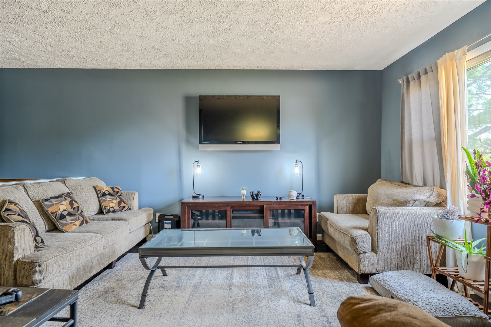 1704 Braden Drive Normal, IL 61761 - Photo 6 of 31 a living room with furniture and a flat screen tv