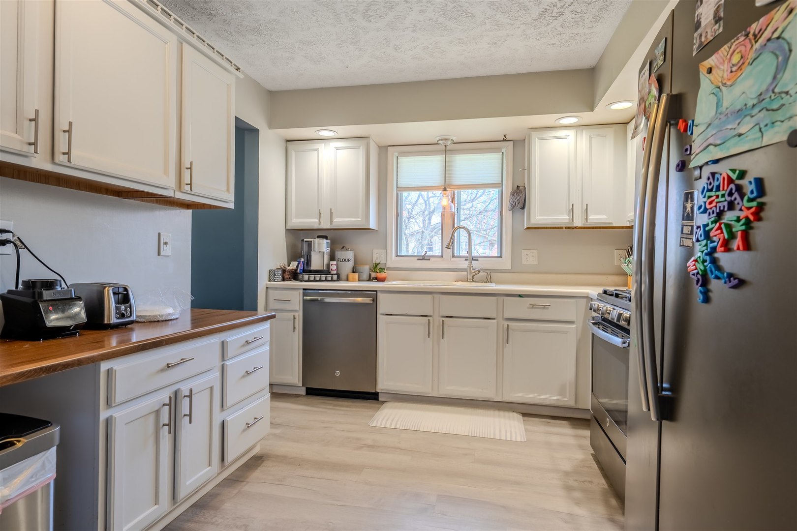 1704 Braden Drive Normal, IL 61761 - Photo 10 of 31 a kitchen with a sink cabinets and stainless steel appliances