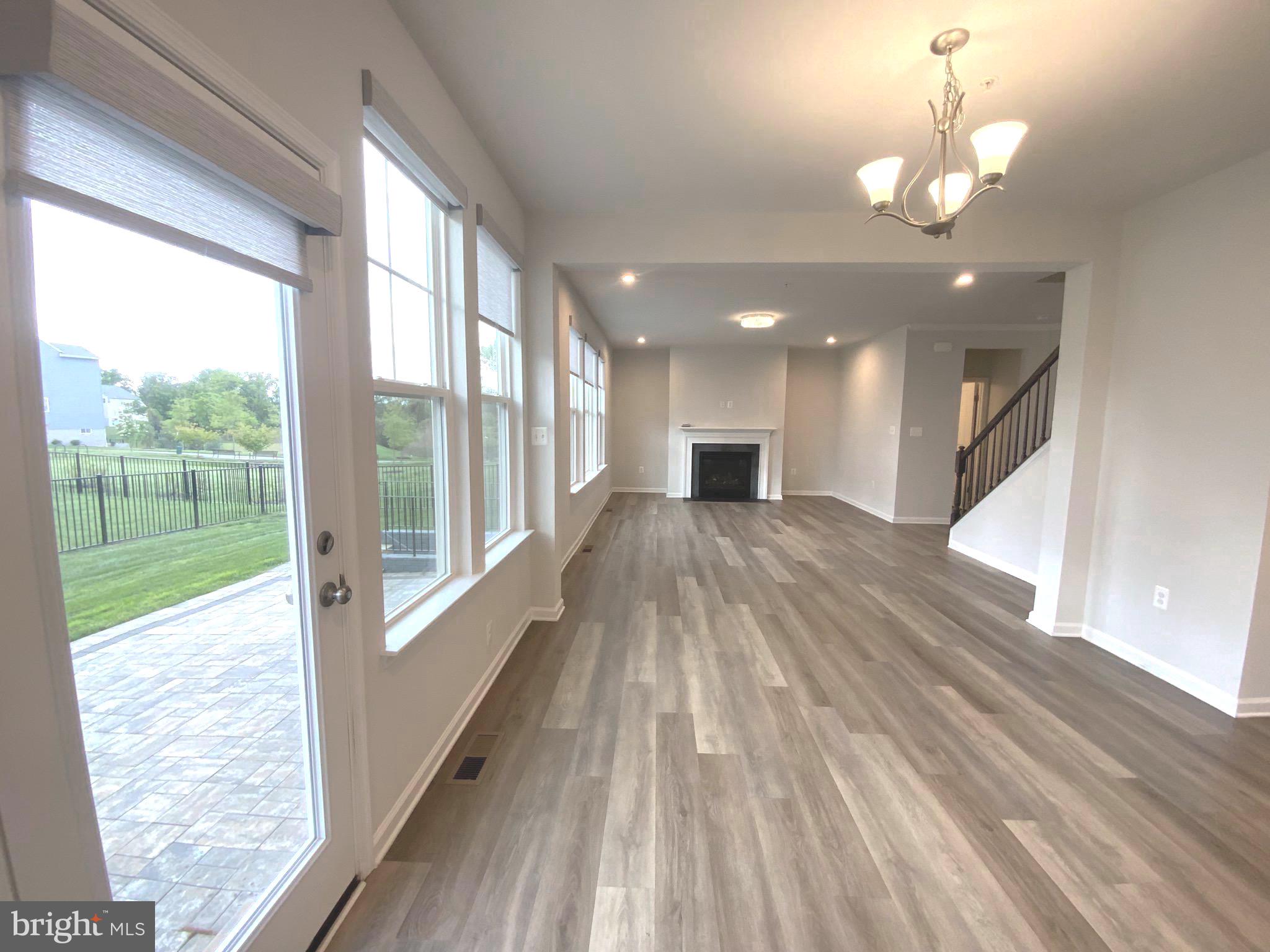 5763 Hawk Ridge Road Frederick, MD 21704 - Photo 12 of 73 a view of a living room and a floor to ceiling window