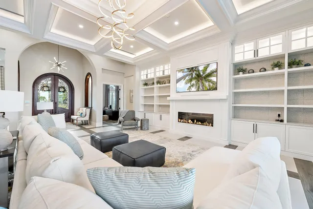 a bedroom with a bed window and flat screen tv