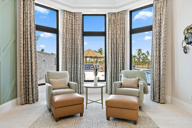 a kitchen with stainless steel appliances granite countertop a sink a stove and a refrigerator with wooden floor