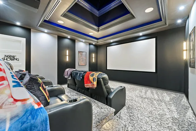 a dining room with furniture and a floor to ceiling window
