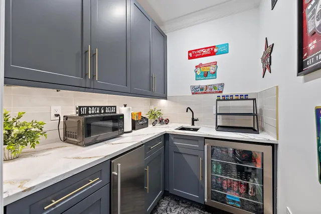 a living room with fireplace furniture and a large window