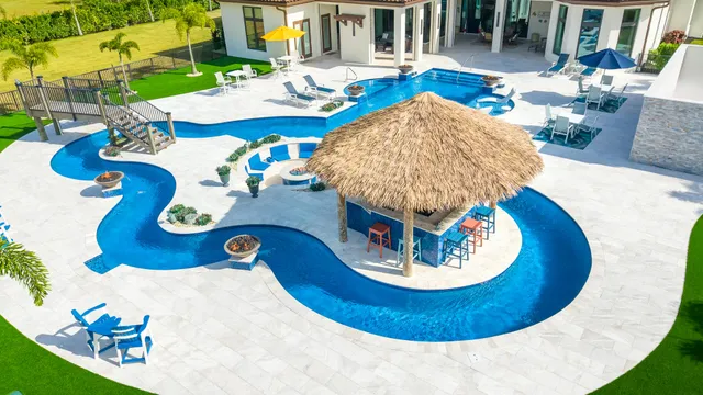 a view of a grey house with a yard